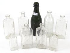 A collection of vintage glass medicine bottles.