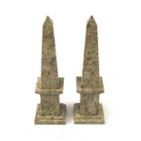A pair of sedimentary stone obelisks.