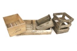A group of assorted vintage wooden fruit crates.