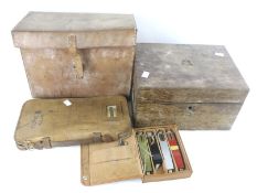 An antique medical box and three leather cases.