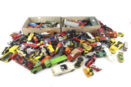 A collection of assorted playworn die cast vehicles.