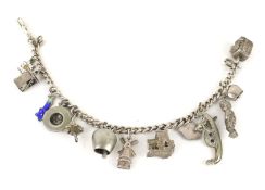 A silver curb link 'charm' bracelet. Hung with 14 various charms.