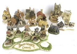 A collection of assorted David Winter model cottages
