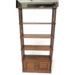 A 20th century mahogany free standing shelving unit.