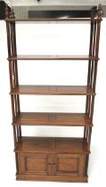 A 20th century mahogany free standing shelving unit.