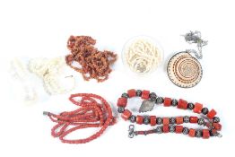 A cultured-pearl necklace, three coral necklaces and other items.