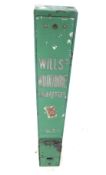 A vintage Wills's Woodbine Cigarettes vending machine. Painted green, wall mounted.