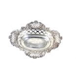 An Edwardian silver shaped-oval, pierced and floral embossed sweet dish.