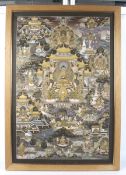 A Buddhist 'Thangka' picture. 90cm x 60cm, framed and glazed.