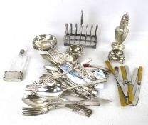 A collection of silver plate. Including flatware, a toast rack, sweet dishes, sugar shaker, etc.