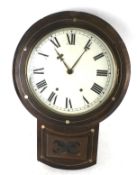 A rosewood veneer pendulum wall clock. With white dial and Roman numerals.