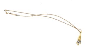 A vintage yellow metal bayonet clasp necklace with a pendant modelled as three paintbrushes, L25cm,