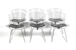 A set of six Henry Bertoia side chairs. Chrome wirework chairs with seat pads.