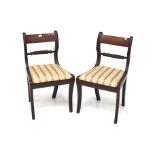 A pair of Regency style mahogany bar back dining chairs. With rope stretcher with drop in seats.