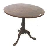 An oak circular occasional table.