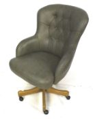 Grey leather executive high button back office chair.