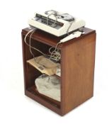 A vintage Grundig Stenorette L reel to reel dictation machine. In a wooden cabinet on castors.