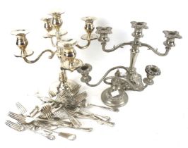 Silver plated items including flatware and three candlesticks. Max.
