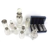 A group of nine assorted silver mounted clear cut-glass scent and dressing table bottles.