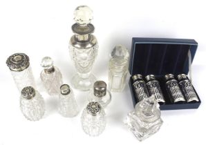 A group of nine assorted silver mounted clear cut-glass scent and dressing table bottles.