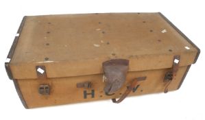 A vintage canvas and leather bound travel trunk and contents.