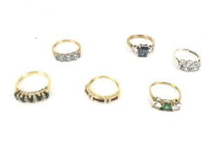 A group of six 9ct gold and gem set dress rings.