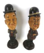 Two vintage Laurel and Hardy resin figures.