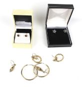 A collection of earrings including two pairs of 9ct gold hoops. These weigh 4.