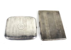 Two silver cigarette cases.