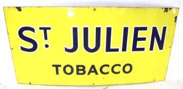 A vintage enamel advertising sign 'St Julien Tobacco'. On a yellow ground with blue lettering.