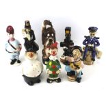Eight novelty china decanter bottles. Including a musical example 'The Last Shot', etc. Max.