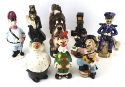 Eight novelty china decanter bottles. Including a musical example 'The Last Shot', etc. Max.
