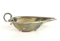 An Art Deco silver shallow oval sauce boat.