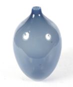 A hand blown sky blue glass vase.