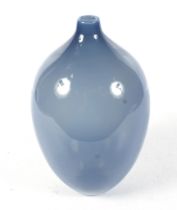 A hand blown sky blue glass vase.