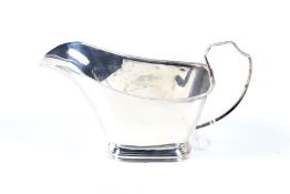 A vintage small silver sauce boat.