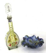 A hand blown retro glass ashtray and novelty bottle.