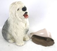 Beswick ceramic Dulux dog and a Poole shell. The dog in a seated pose, H29.