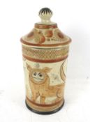 A hand painted storage jar and lid from Mexico.