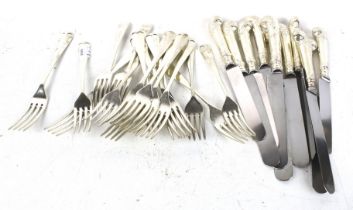 An assortment of silverplated and stainless steel flatware.