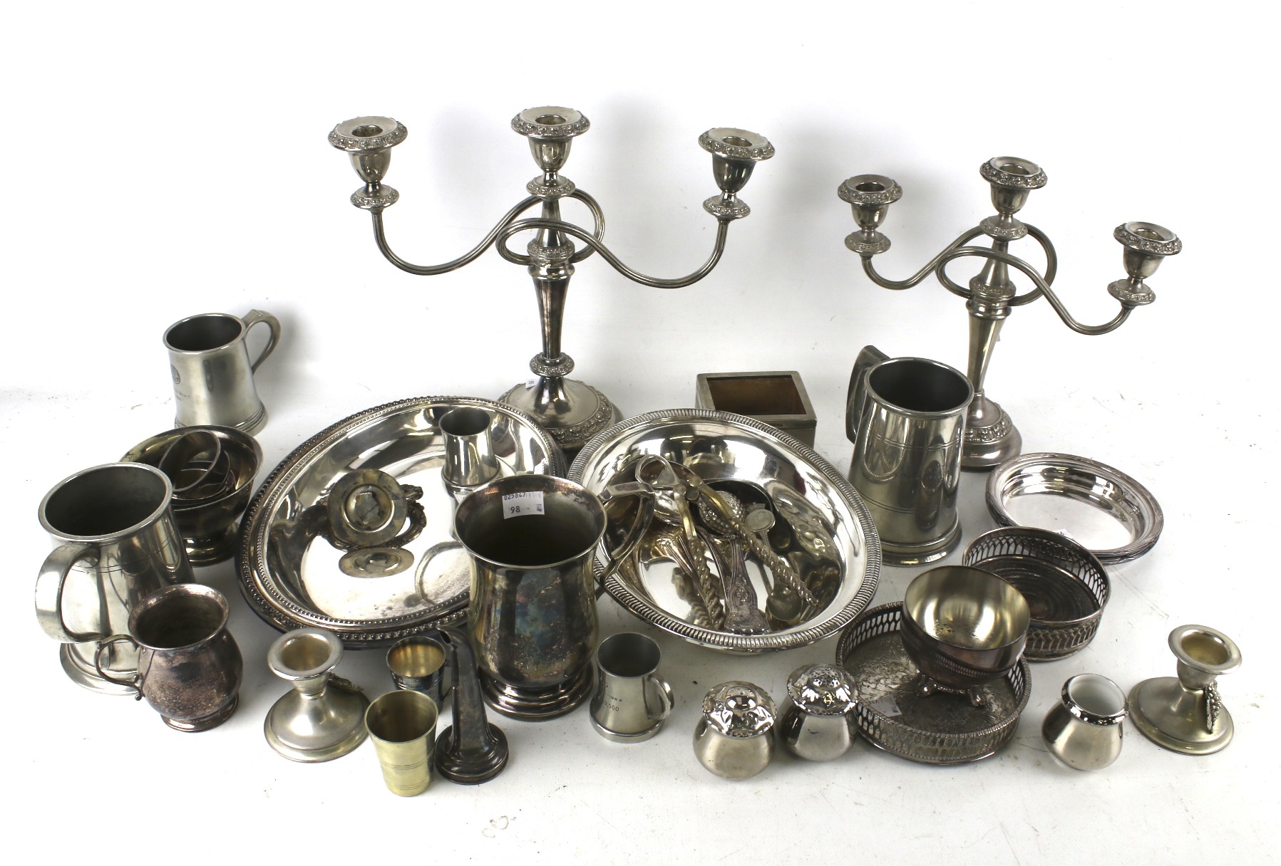A collection of silver plate and pewter including two three-light/two-branch candelabra;