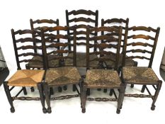 A set of seven ladderback dining chairs (6+1).
