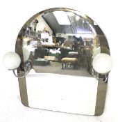 An illuminated Art Deco style arched wall mirror. With two globe lights.