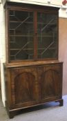 A Georgian style mahogany astral glazed display cabinet bookcase.