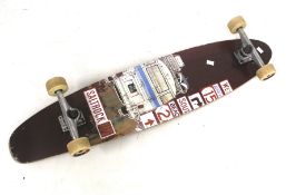 A vintage Longboard Saltrock skateboard.