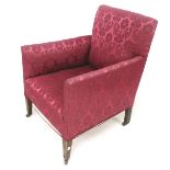 A red upholstered armchair on casters.
