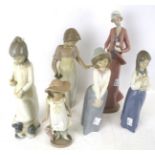 A collection of six various Nao porcelain figures. Max.