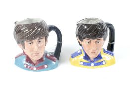 Two Royal Doulton Beatles character jugs. 'John Lennon' and 'Paul McCartney', H12.