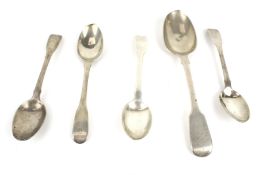 A set of four George III silver fiddle pattern tea spoons, and a dessert spoon.