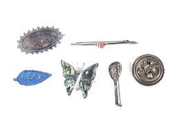 Six silver brooches.